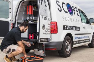 tom holding a door handle from Scope Security Pty Ltd mobile locksmith service in Sydney that is available 24 hours a day